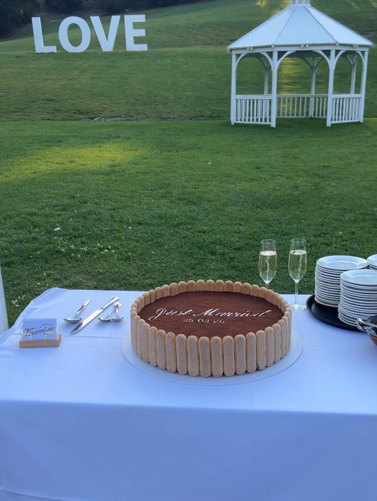 Tiramisu wedding cake on a styled outdoor table